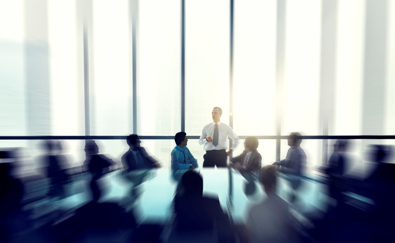Man standing in a boardroom